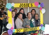 Josie Madrigal (in green) celebrates her 90th birthday in the company of her sisters, family members and friends on Dec. 21 at the Tachi Palace Hotel and Casino.